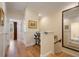 Upstairs hallway with hardwood floors and stairway at 4709 Fox St, Orlando, FL 32814