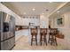 Updated kitchen with granite countertops, breakfast bar, and stainless steel refrigerator at 4709 Fox St, Orlando, FL 32814