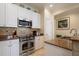 Close up of kitchen features stainless steel appliances and granite countertops at 4709 Fox St, Orlando, FL 32814
