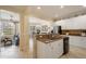 Open kitchen layout with granite countertops, stainless appliances, and bright adjacent living space at 4709 Fox St, Orlando, FL 32814