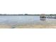 Expansive lake view featuring a charming pier with a quaint gazebo at 4709 Fox St, Orlando, FL 32814