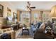 Charming living room featuring comfortable seating, plantation shutters, and stylish decor at 4709 Fox St, Orlando, FL 32814