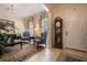 Cozy living room featuring a chandelier, neutral paint, stylish furniture, and tile floors at 4709 Fox St, Orlando, FL 32814