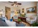Comfortable living room with stylish seating, decor, and a view to the hallway at 4709 Fox St, Orlando, FL 32814