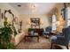 Elegant living room featuring a chandelier, neutral paint, stylish furniture, and natural light at 4709 Fox St, Orlando, FL 32814
