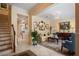Inviting living room featuring tile floors, stylish furnishings, and a staircase at 4709 Fox St, Orlando, FL 32814