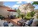 Charming brick patio featuring cozy seating arrangements, dining area, and lush landscaping at 4709 Fox St, Orlando, FL 32814