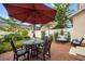 Cozy patio with an outdoor dining area, lounge seating, and well-maintained garden at 4709 Fox St, Orlando, FL 32814