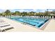 Resort-style community pool with lounge chairs and clear blue water, perfect for relaxation at 4709 Fox St, Orlando, FL 32814