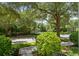 Shaded street view with green landscaping, mature trees, and a glimpse of a well-maintained neighborhood at 4709 Fox St, Orlando, FL 32814