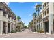 Charming town center featuring brick streets, palm trees, storefronts, and residences with balconies at 4709 Fox St, Orlando, FL 32814