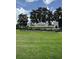 Community entrance with manicured lawns and a decorative sign for The Retreat at Wekiva at 5040 Rock Rose Loop, Sanford, FL 32771