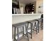 Spacious kitchen with a breakfast bar and wooden stools offering seating at 5040 Rock Rose Loop, Sanford, FL 32771