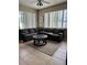 Comfortable living room featuring a large sectional sofa and natural light at 5040 Rock Rose Loop, Sanford, FL 32771