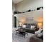 Neutral living room with sofa, coffee table and decorations on a display shelf at 5040 Rock Rose Loop, Sanford, FL 32771