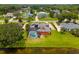 Admire this home with a screened-in pool and outdoor entertaining area, set against a beautiful lakeside backdrop at 5306 Crane Hill Ct, St Cloud, FL 34771