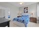 Cozy bedroom with a comfortable bed, stylish decor, and ample closet space at 5306 Crane Hill Ct, St Cloud, FL 34771