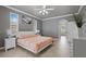 Bedroom boasts multiple windows, white trim, neutral walls, and attached bathroom at 5306 Crane Hill Ct, St Cloud, FL 34771