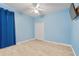Clean, tiled bedroom with a closet and an open window, offering ample space and natural light at 5306 Crane Hill Ct, St Cloud, FL 34771