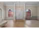 Grand foyer showcasing high ceilings, elegant lighting, and beautiful tile flooring, setting a luxurious tone at 5306 Crane Hill Ct, St Cloud, FL 34771