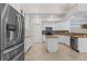 Spacious kitchen featuring modern stainless steel appliances, granite countertops, and center island at 5306 Crane Hill Ct, St Cloud, FL 34771