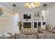 Inviting living room features a fireplace, built-in shelving, and neutral decor at 5306 Crane Hill Ct, St Cloud, FL 34771