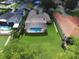 A beautiful house features a screened pool, spacious green yard and a well-maintained roof at 5416 Bay Side Dr, Orlando, FL 32819