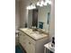 Bathroom showcasing a double sink vanity with granite countertops and large mirror at 5416 Bay Side Dr, Orlando, FL 32819