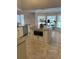 Kitchen with island featuring granite countertops, seating area, and built-in microwave oven at 5416 Bay Side Dr, Orlando, FL 32819