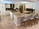 Beautiful kitchen boasting dual islands, sleek white cabinetry, granite countertops, and modern appliances at 5416 Bay Side Dr, Orlando, FL 32819