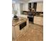 Updated kitchen with stainless steel appliances, granite countertops and white cabinetry at 5416 Bay Side Dr, Orlando, FL 32819