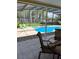 Backyard pool area featuring pool, hot tub, patio furniture and a view of the lake beyond at 5416 Bay Side Dr, Orlando, FL 32819