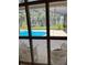 View from lanai of screened-in pool, outdoor seating and lake at 5416 Bay Side Dr, Orlando, FL 32819