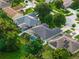 Aerial view of a home with a screened-in pool and solar panels at 544 Lake Sumner Dr, Groveland, FL 34736