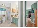 Charming bathroom with vanity, decorative mirror, and shower with tub at 544 Lake Sumner Dr, Groveland, FL 34736