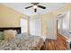 Cozy bedroom with ceiling fan, closet, and inviting decor at 544 Lake Sumner Dr, Groveland, FL 34736