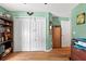 Bedroom featuring built-in wardrobe for great storage and wood flooring at 544 Lake Sumner Dr, Groveland, FL 34736