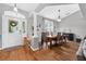 Open-concept dining area featuring modern decor and a hardwood floor at 544 Lake Sumner Dr, Groveland, FL 34736
