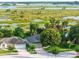 A beautifully landscaped home featuring mature trees and a well-maintained lawn in a peaceful residential neighborhood at 544 Lake Sumner Dr, Groveland, FL 34736