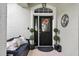 Charming front entrance with decorative wreath, seating, and personalized decor elements at 544 Lake Sumner Dr, Groveland, FL 34736