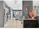 Well-lit kitchen with modern gray cabinetry, stainless steel appliances, and views of the outdoors at 544 Lake Sumner Dr, Groveland, FL 34736