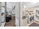 Convenient laundry room features washer, dryer, and storage shelves at 544 Lake Sumner Dr, Groveland, FL 34736