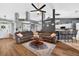 Inviting living room area with a ceiling fan and bar seating at 544 Lake Sumner Dr, Groveland, FL 34736
