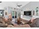 Comfortable living room features a ceiling fan and a sliding glass door to the backyard at 544 Lake Sumner Dr, Groveland, FL 34736