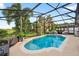 Private screened-in pool offers a perfect space for relaxation and recreation at 544 Lake Sumner Dr, Groveland, FL 34736