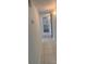 Bright hallway with tiled floors leading to a bathroom with modern fixtures at 5935 Sheryl Anita St, Oviedo, FL 32765