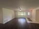Bright living room with large windows, hardwood floors, and a welcoming entrance at 5935 Sheryl Anita St, Oviedo, FL 32765