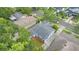 Bird's eye view showing a charming blue house, greenery, and neighboring homes at 638 Clayton St, Orlando, FL 32804