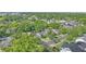 Aerial landscape view featuring a home nestled within a tree-lined neighborhood and nearby amenities at 638 Clayton St, Orlando, FL 32804