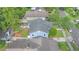 Overhead shot of blue home with gray roof, complemented by landscaped yard and surrounding residences at 638 Clayton St, Orlando, FL 32804